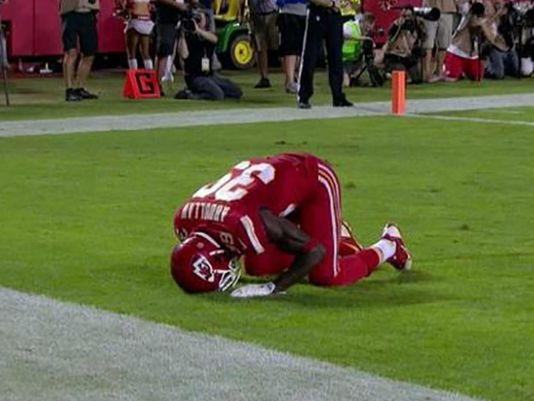 Kansas City Chiefs free safety Husain Abdullah carries the ball after  intercepting a pass and running it back 39 yards for a touchdown during the  fourth quarter of an NFL football game