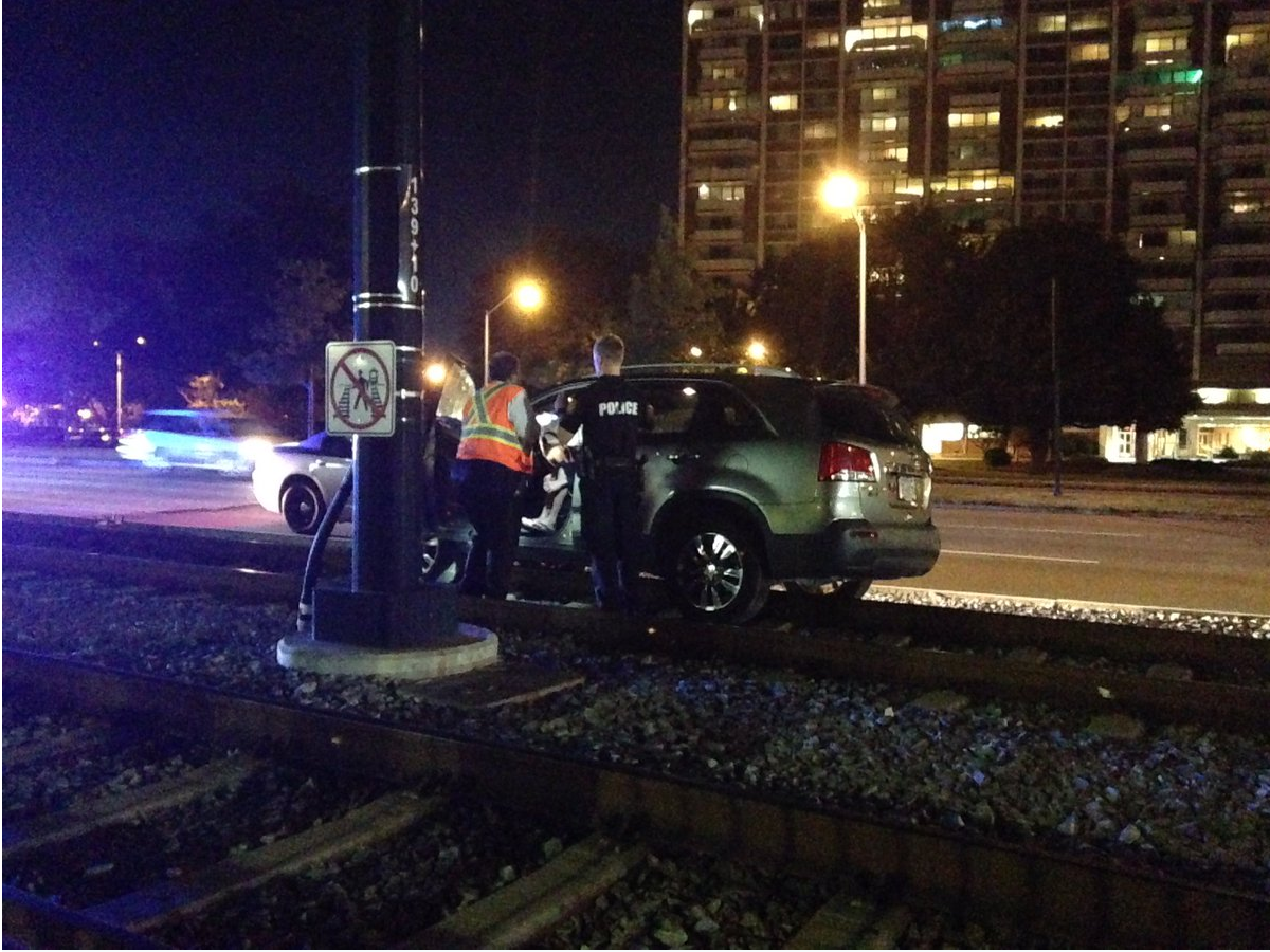 Car turns onto Light rail tracks causes trains to turn around ...